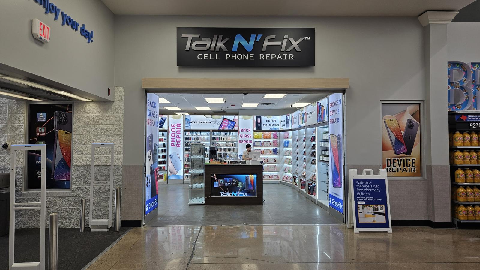 Modern tech repair store entrance with illuminated service banners