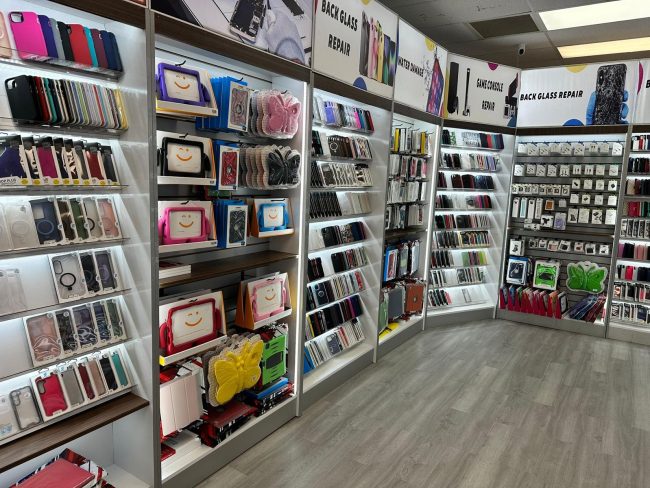 Clean retail wall with neatly organized phone protection accessories