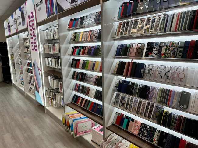 Display shelf filled with protective iPad cases and tablet stands